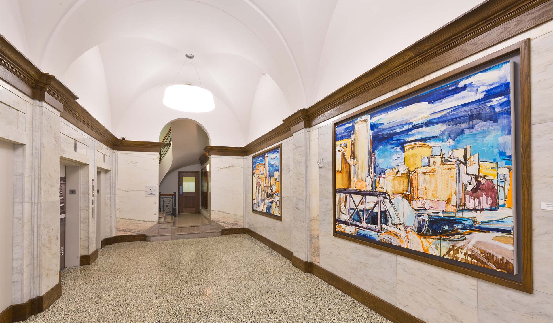 Marble walls and original columns and molding featured in our lobby
